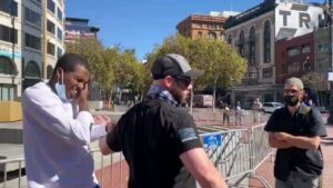 Read more about the article Philip Anderson, a free speech rally leader, punched by counter protester and pu